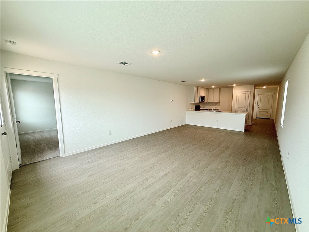 413 Moscato Road New Braunfels, TX 78130 - Photo 9 of 28 wooden floor in an empty room
