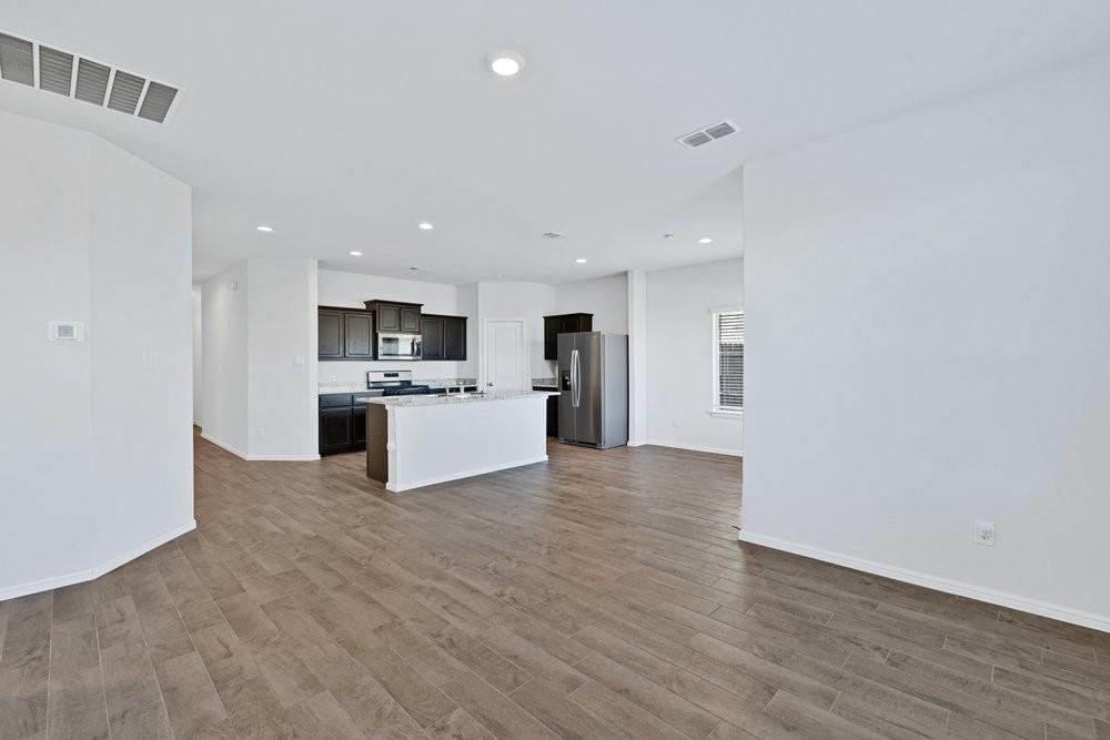 9632 Cherryville Road Fort Worth, TX 76108 - Photo 11 of 40 Good flow through to the open kitchen