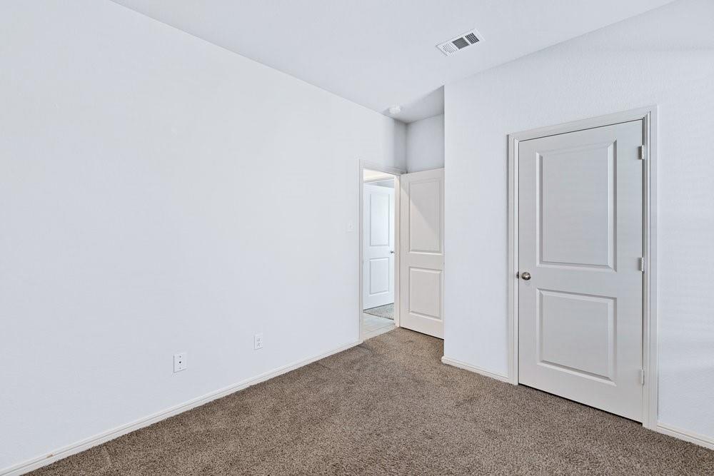 9632 Cherryville Road Fort Worth, TX 76108 - Photo 26 of 40 Large closet in this secondary bedroom. Shares a hallway with the front bedroom and bathroom
