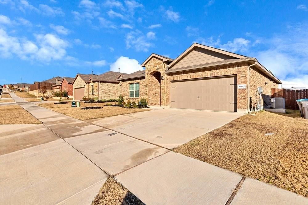 9632 Cherryville Road Fort Worth, TX 76108 - Photo 4 of 40 2 car garage, stone and brick exterior