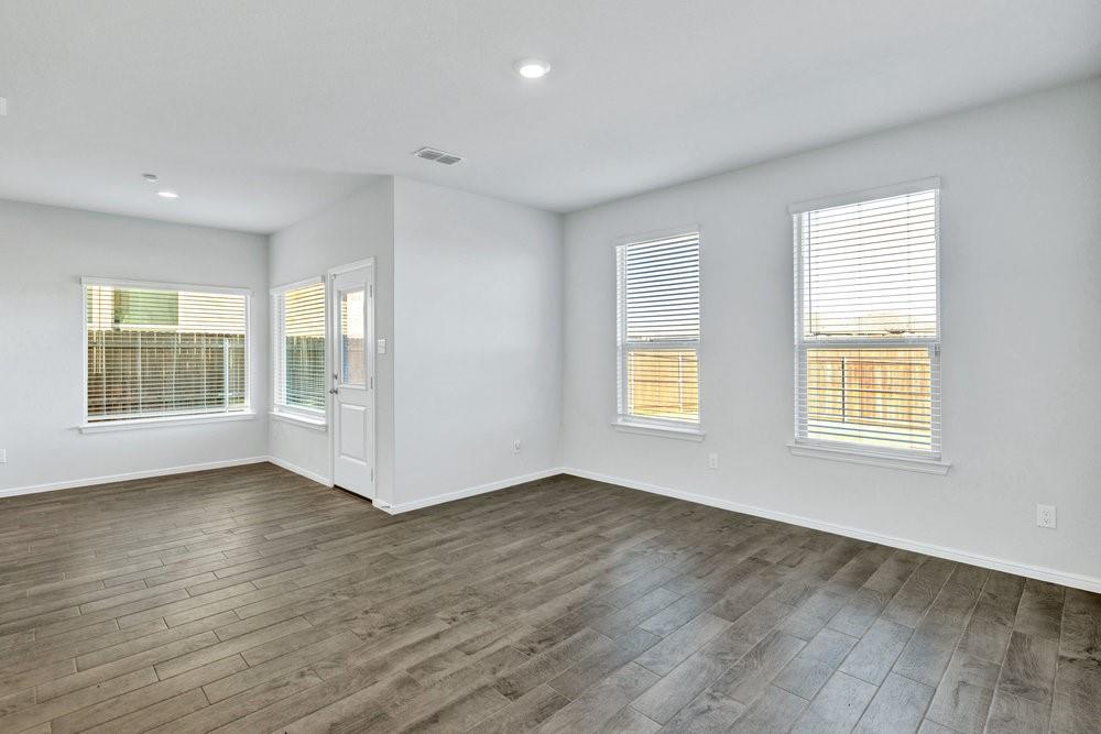 9632 Cherryville Road Fort Worth, TX 76108 - Photo 9 of 40 Warm wood look tile throughout the main living areas.