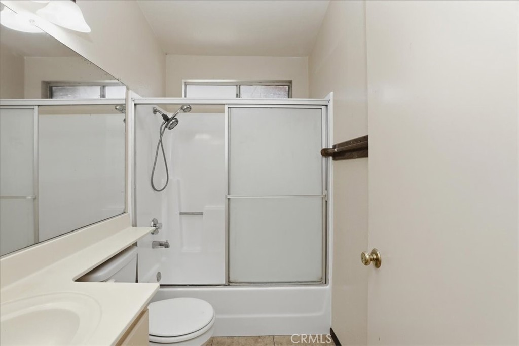 1907 Overland Street Colton, CA 92324 - Photo 17 of 36 a bathroom with a toilet and shower