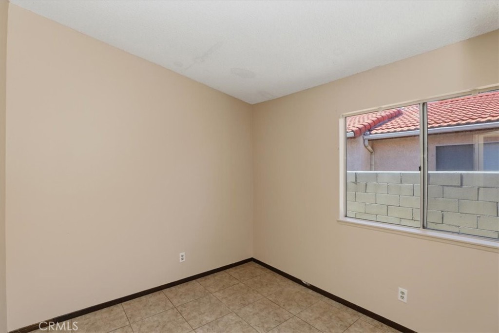 1907 Overland Street Colton, CA 92324 - Photo 22 of 36 an empty room with a window