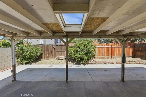 a view of a patio with a table and a chairs