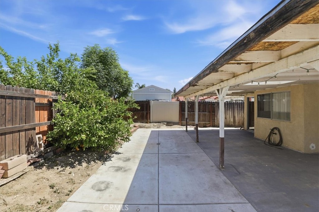 1907 Overland Street Colton, CA 92324 - Photo 27 of 36 a view of a house with a yard and sitting area
