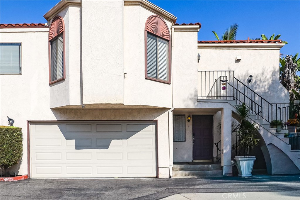 a front view of a house with garage