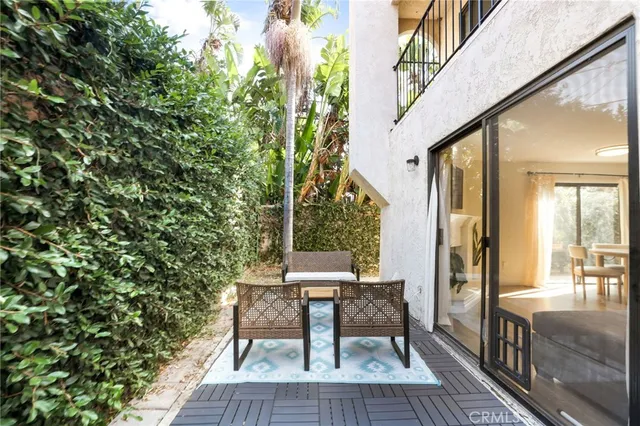 a balcony view with a seating space