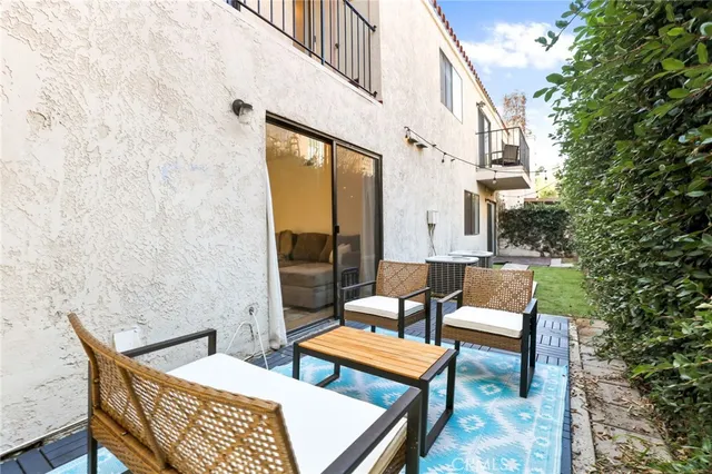 a outdoor living space with patio furniture and a potted plant