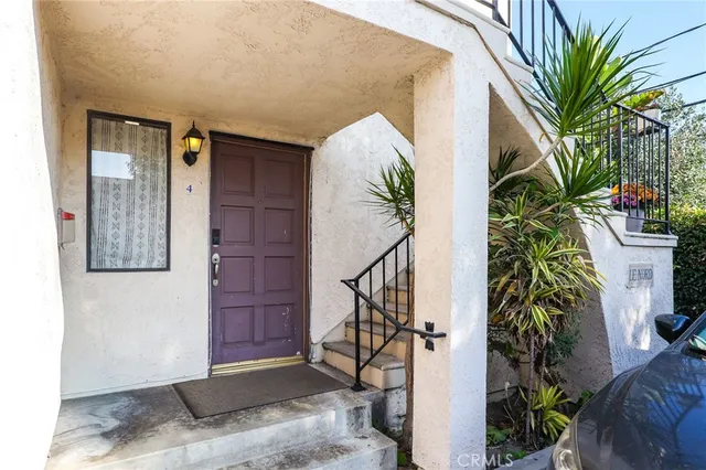 a view of entryway with paintings on the wall