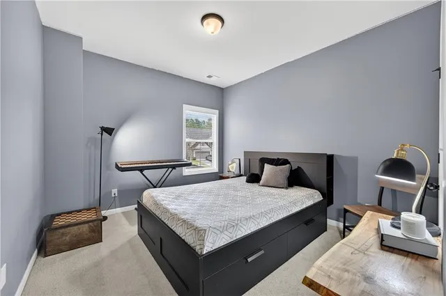 a living room with a bed furniture and a window