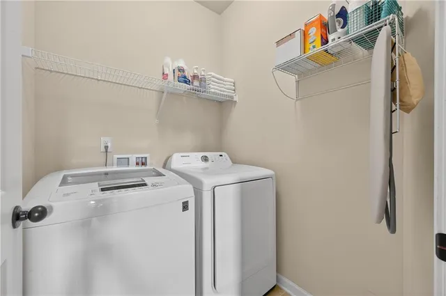 a utility room with dryer and washer