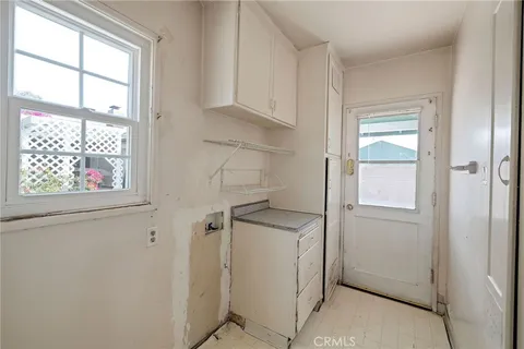 a view of empty room with windows