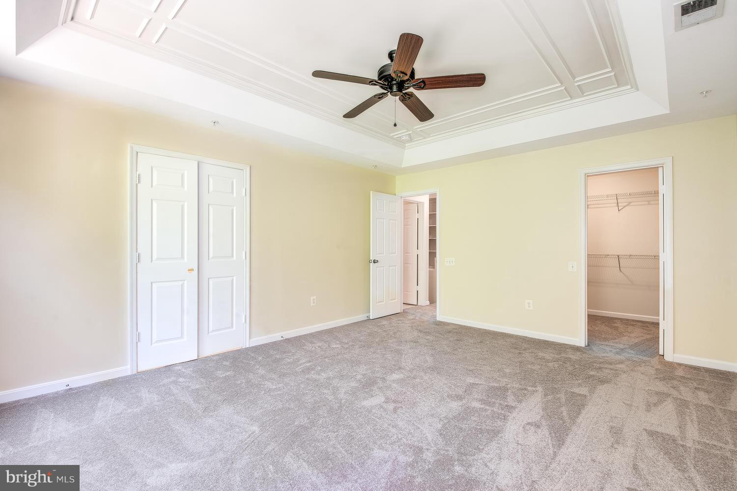 15116 Snow Mass Court Silver Spring, MD 20906 - Photo 13 of 23 Owner's suite: tray ceiling with ceiling fan.