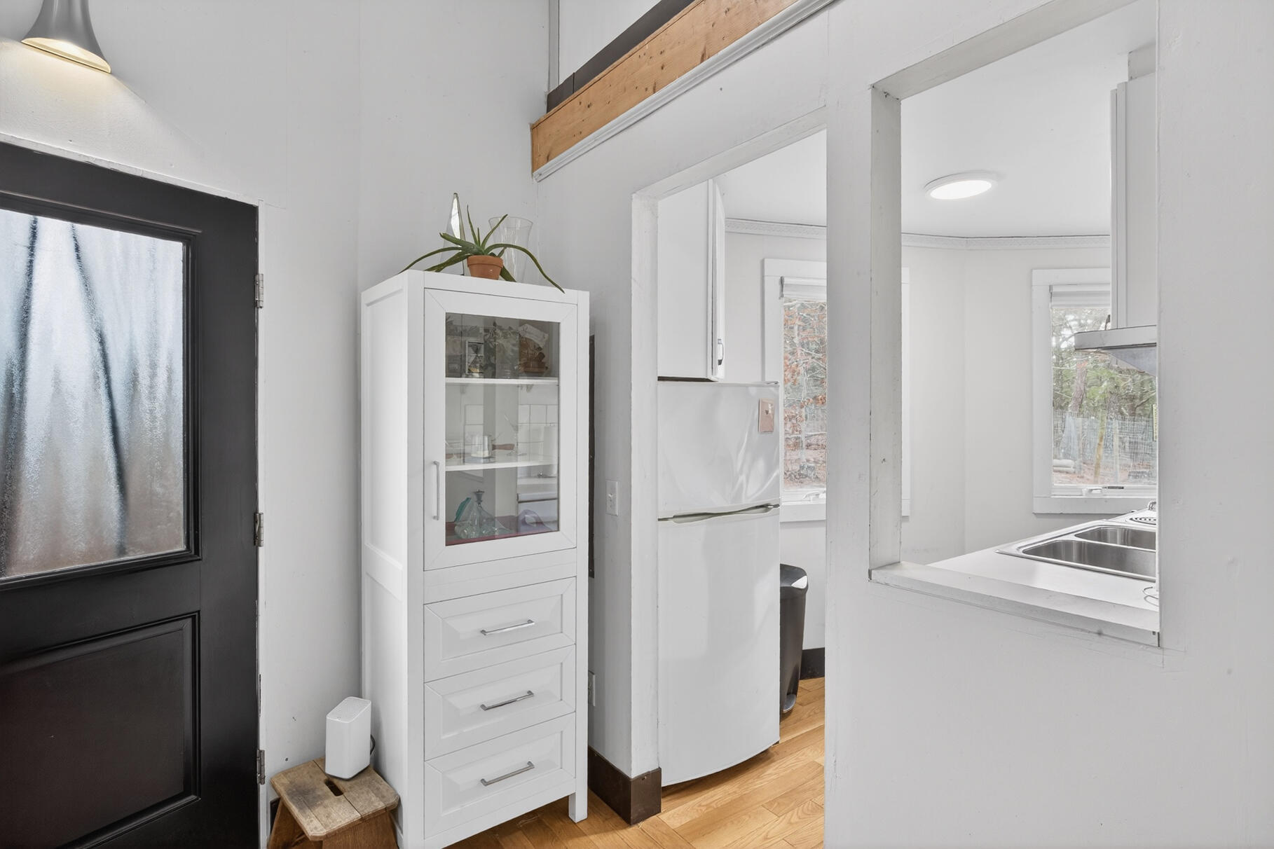19 Old Bridge Road Truro, MA 02666 - Photo 12 of 27 a hallway with white cabinets and wooden floor