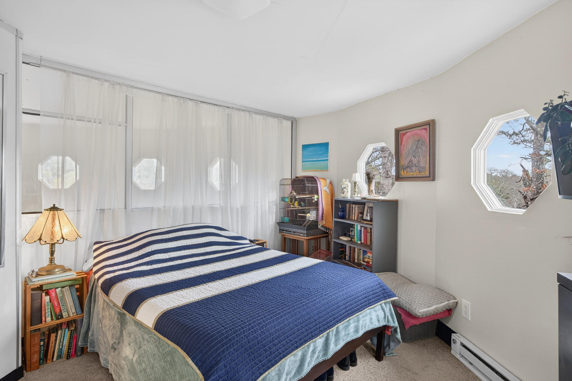 19 Old Bridge Road Truro, MA 02666 - Photo 20 of 27 a bedroom with a bed and a lamp on dresser