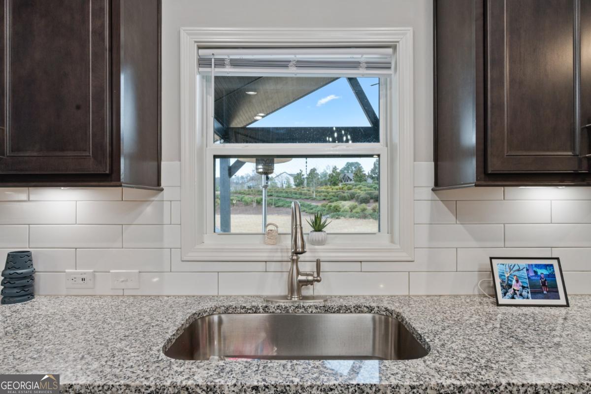 6780 Rambling Vale Dawsonville, GA 30534 - Photo 13 of 52 a kitchen with a sink and a window