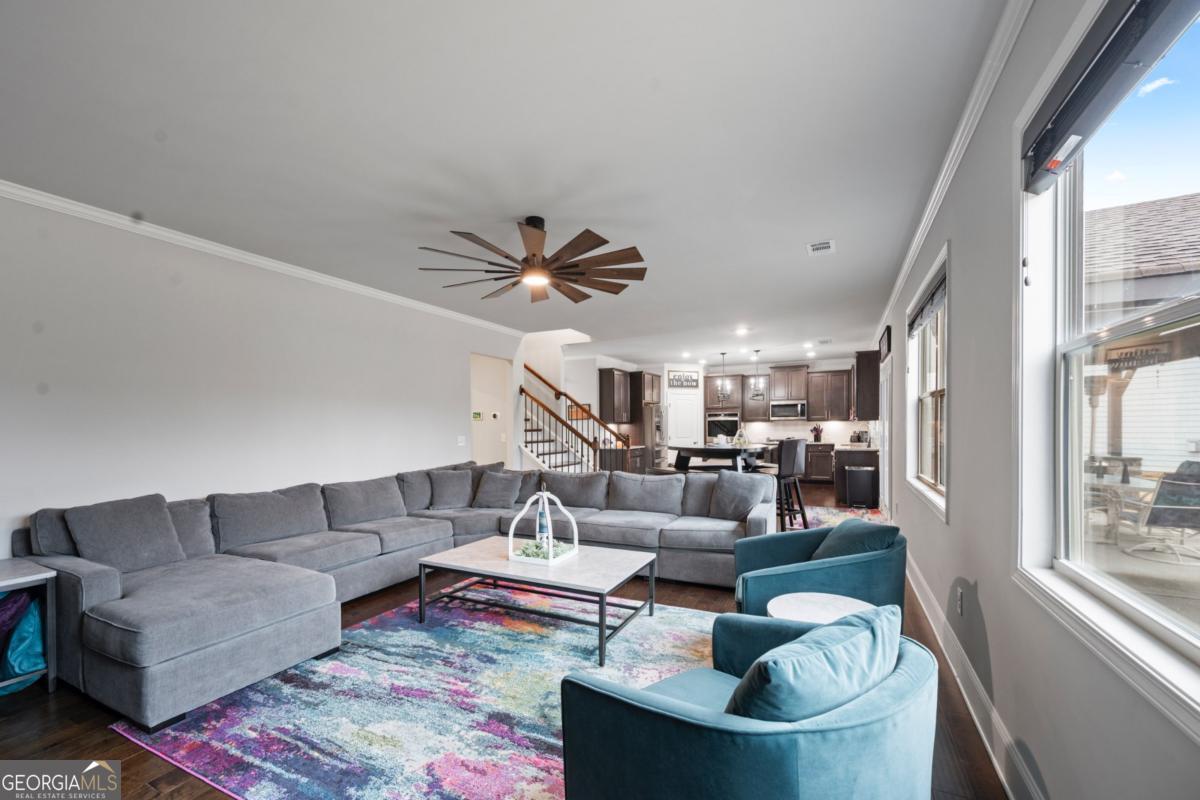 6780 Rambling Vale Dawsonville, GA 30534 - Photo 15 of 52 a living room with furniture and a large window
