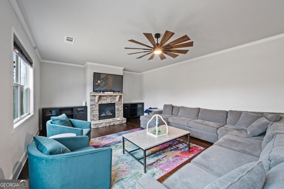 6780 Rambling Vale Dawsonville, GA 30534 - Photo 17 of 52 a living room with furniture and a fireplace