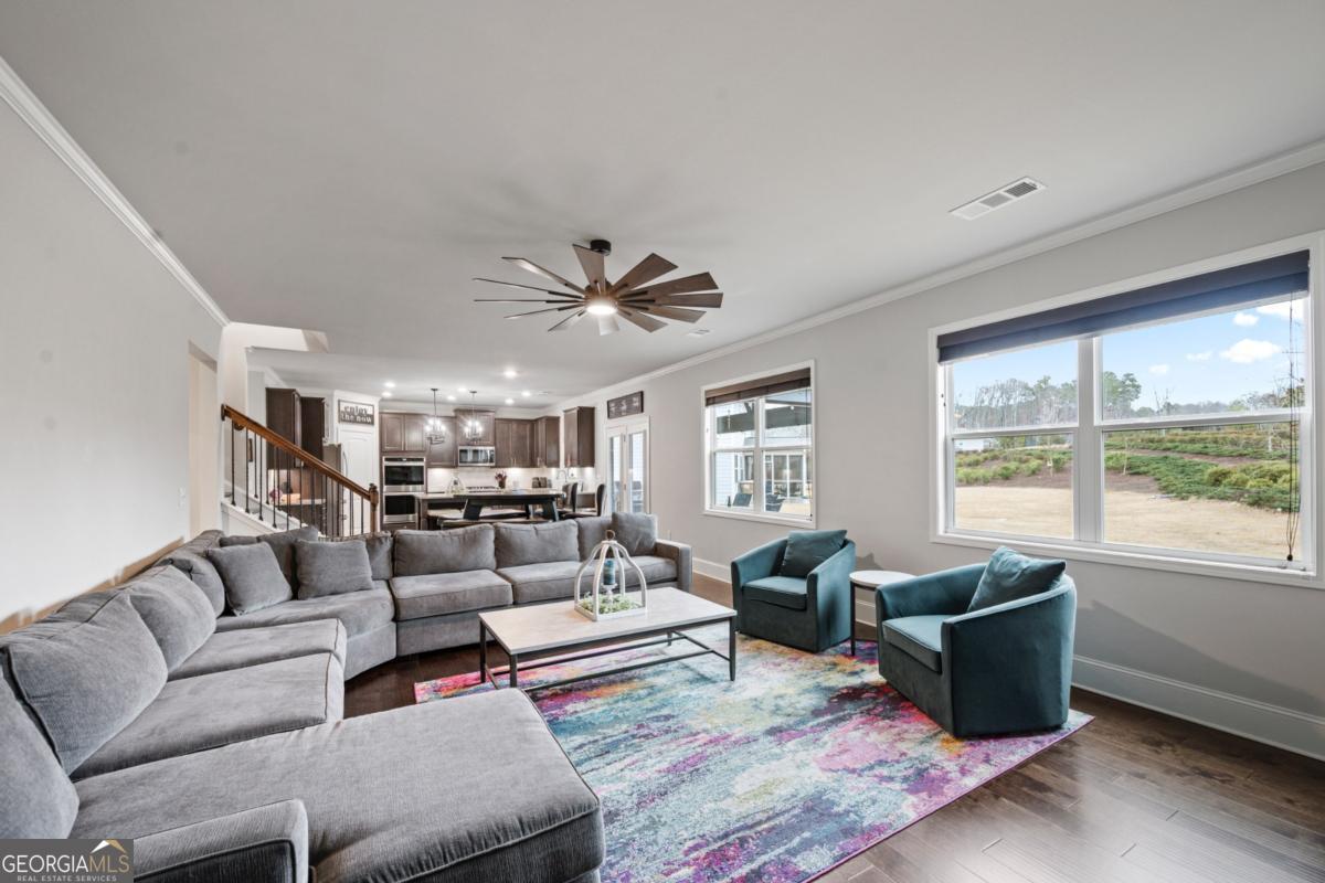 6780 Rambling Vale Dawsonville, GA 30534 - Photo 18 of 52 a living room with furniture and a large window