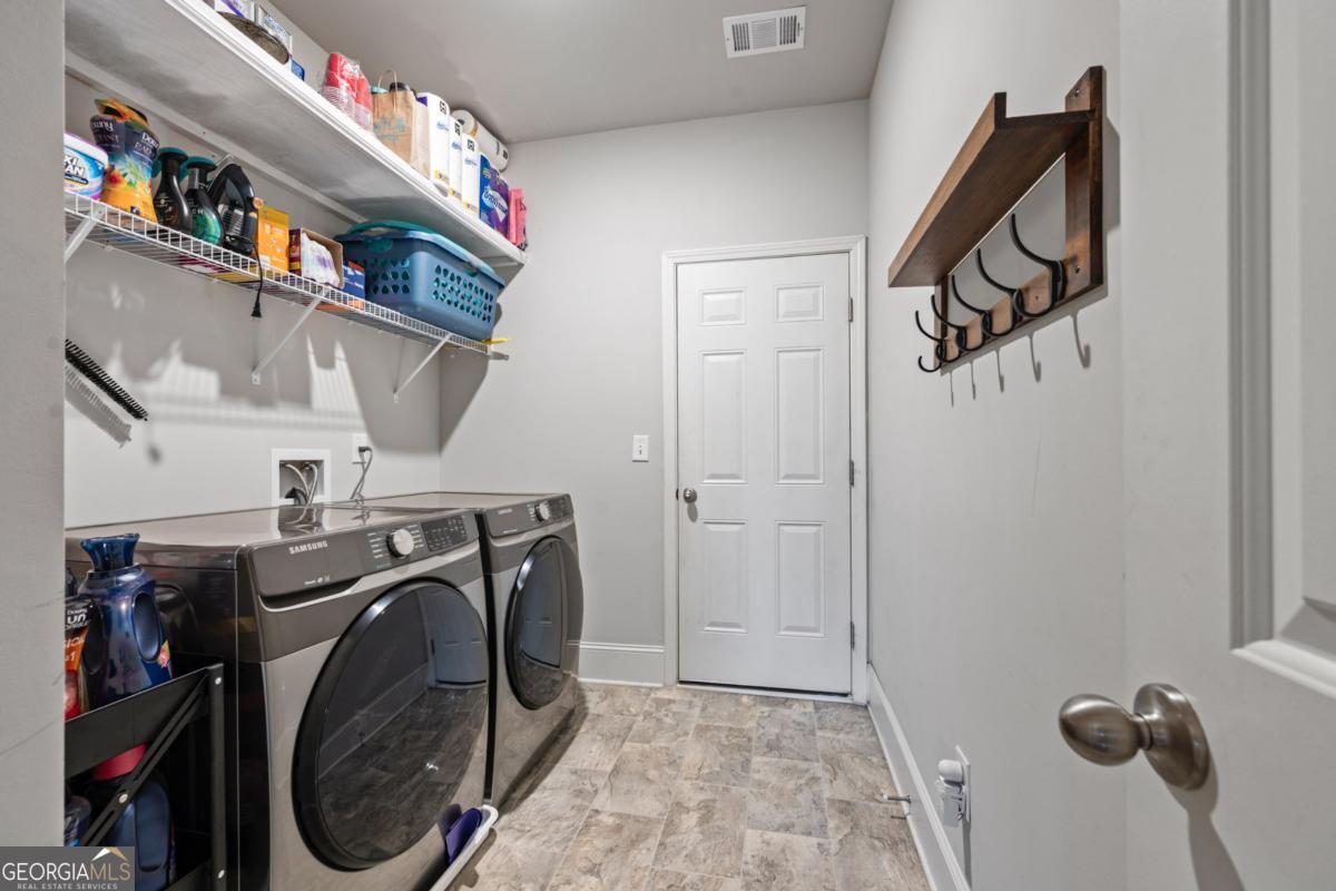 6780 Rambling Vale Dawsonville, GA 30534 - Photo 22 of 52 a utility room with dryer and washer