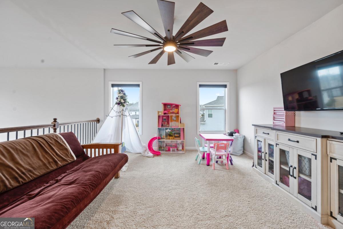 6780 Rambling Vale Dawsonville, GA 30534 - Photo 26 of 52 a living room with furniture and flat screen tv