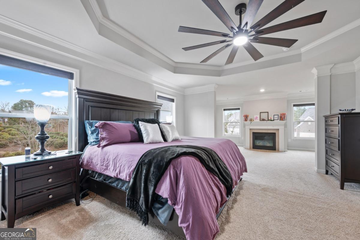 6780 Rambling Vale Dawsonville, GA 30534 - Photo 29 of 52 a bed room with a bed and a fireplace