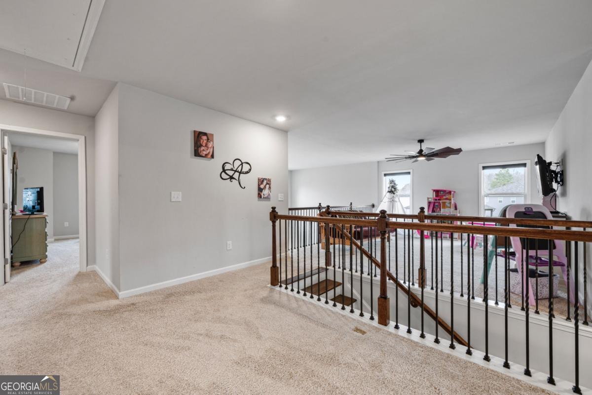 6780 Rambling Vale Dawsonville, GA 30534 - Photo 36 of 52 a view of a hallway with a livingroom
