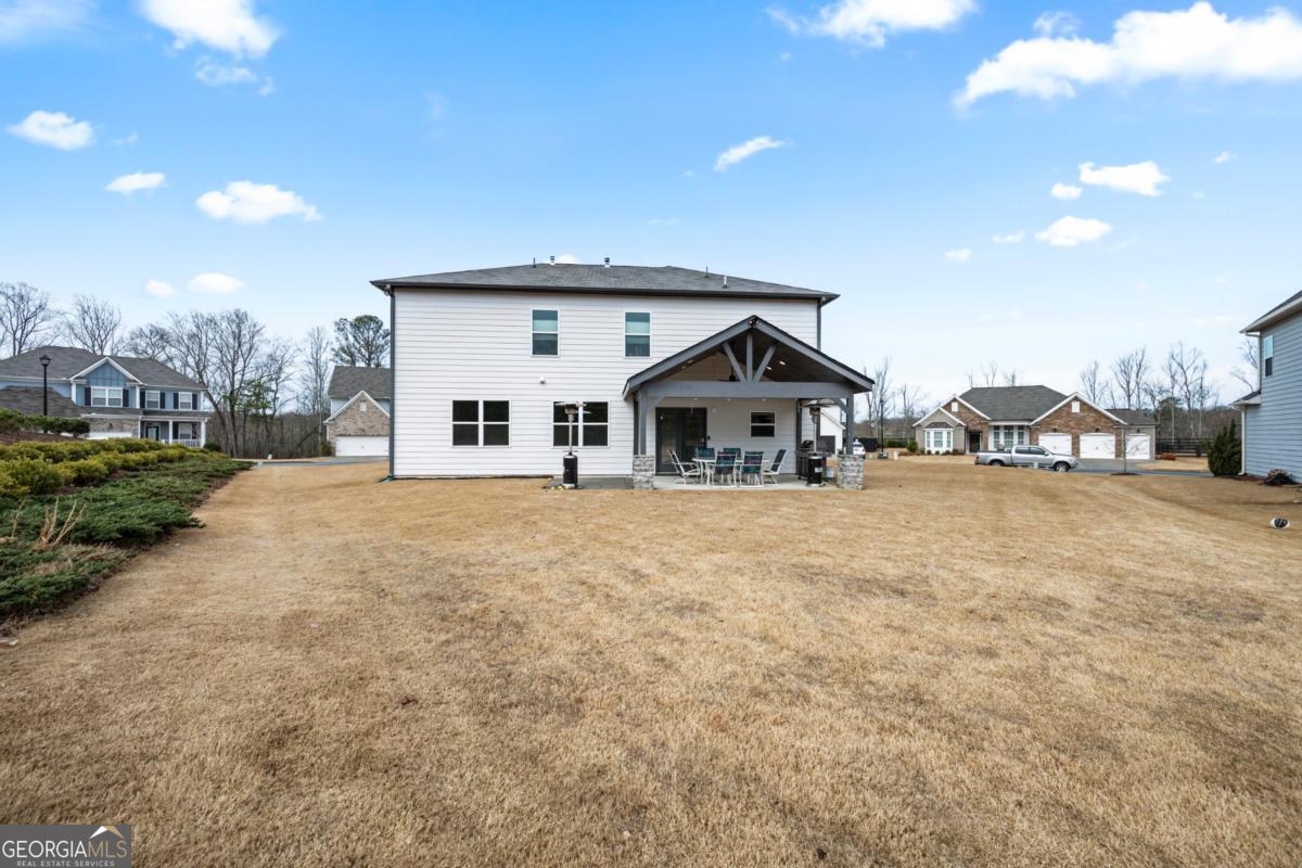 6780 Rambling Vale Dawsonville, GA 30534 - Photo 45 of 52 a front view of a house with a yard