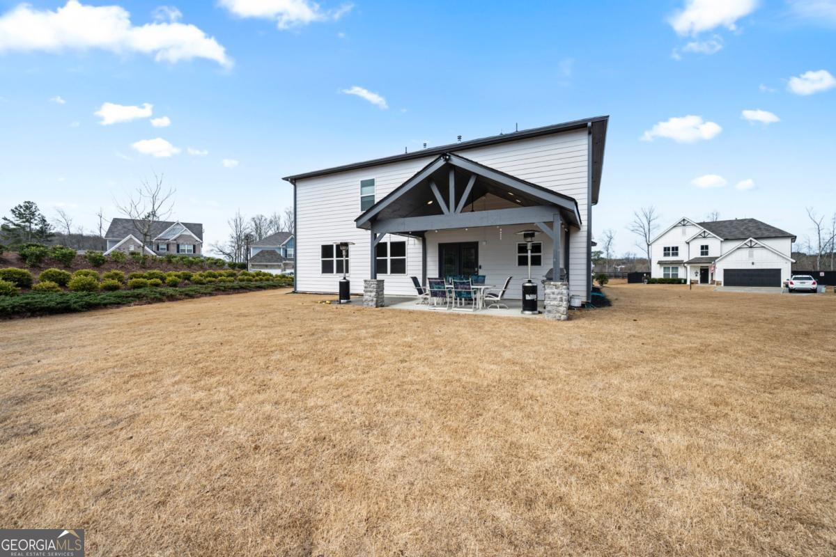6780 Rambling Vale Dawsonville, GA 30534 - Photo 46 of 52 a front view of a house with a yard