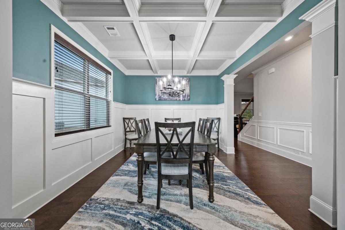 6780 Rambling Vale Dawsonville, GA 30534 - Photo 9 of 52 a view of a dining room with furniture window and wooden floor