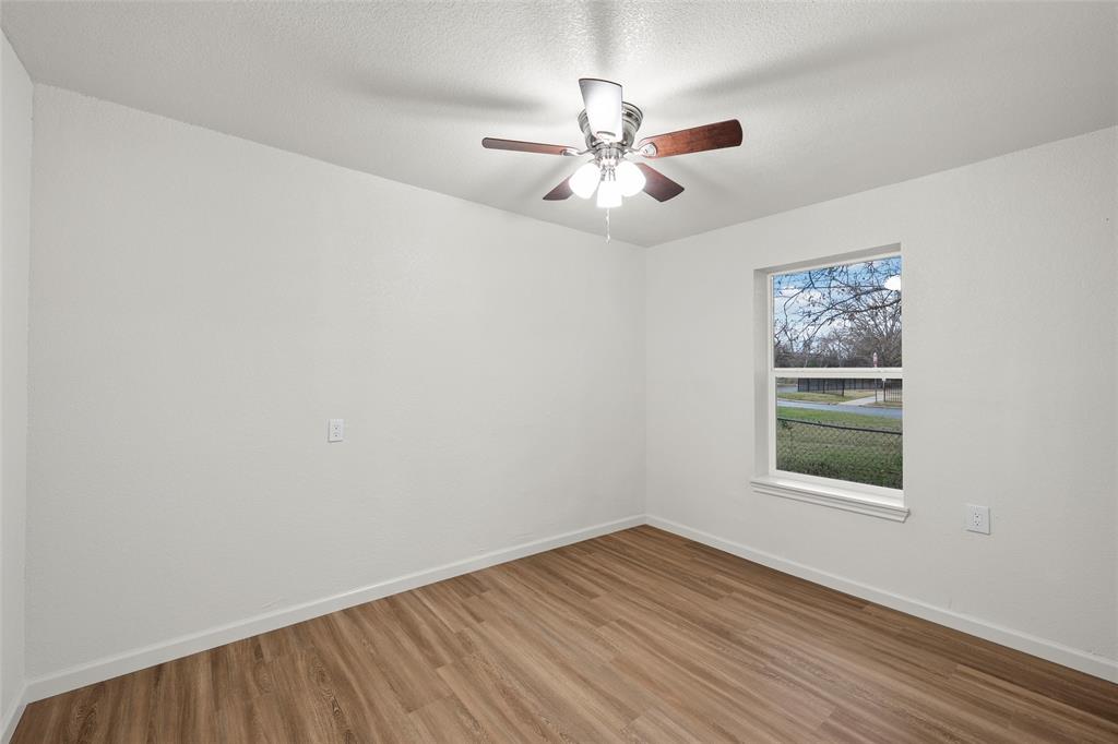 506 Rose Street Waco, TX 76704 - Photo 15 of 25 wooden floor in an empty room with a window