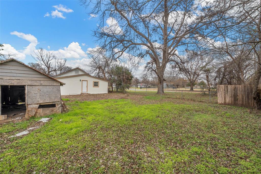 506 Rose Street Waco, TX 76704 - Photo 23 of 25 a view of a house with backyard and trees