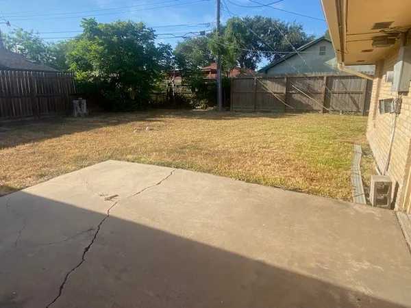 a view of a backyard of the house