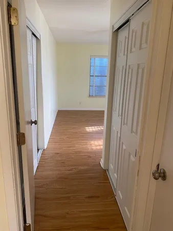 a view of wooden floor and staircase in a room