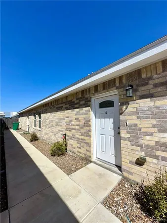 a kitchen with a stove cabinets and wooden floor