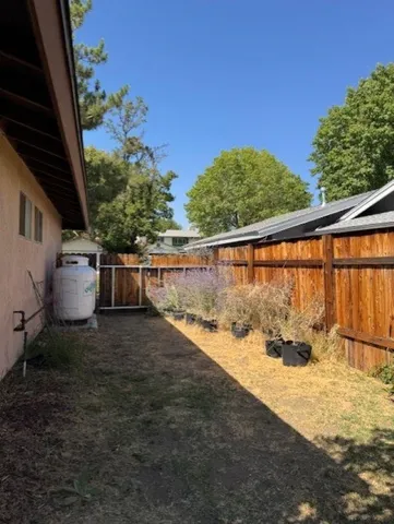 a view of a house with a tree