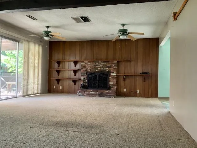 a room with a sink cabinets and wooden floor