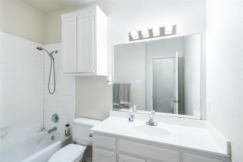 1764 Independence Road Blue Mound, TX 76131 - Photo 3 of 13 a bathroom with a sink and a mirror