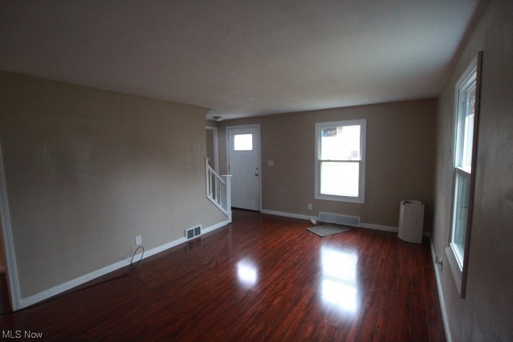 3606 Shelby Road Youngstown, OH 44511 - Photo 6 of 33 Spare room with dark hardwood / wood-style flooring and radiator