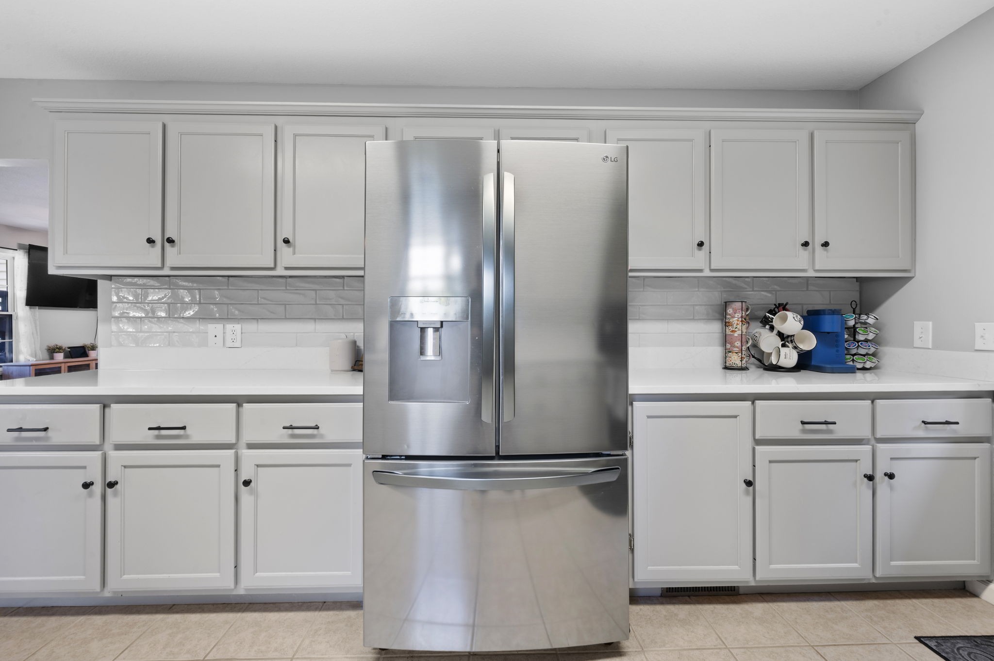 1197 Biter Road Cunningham, TN 37052 - Photo 9 of 38 a kitchen with white cabinets and refrigerator