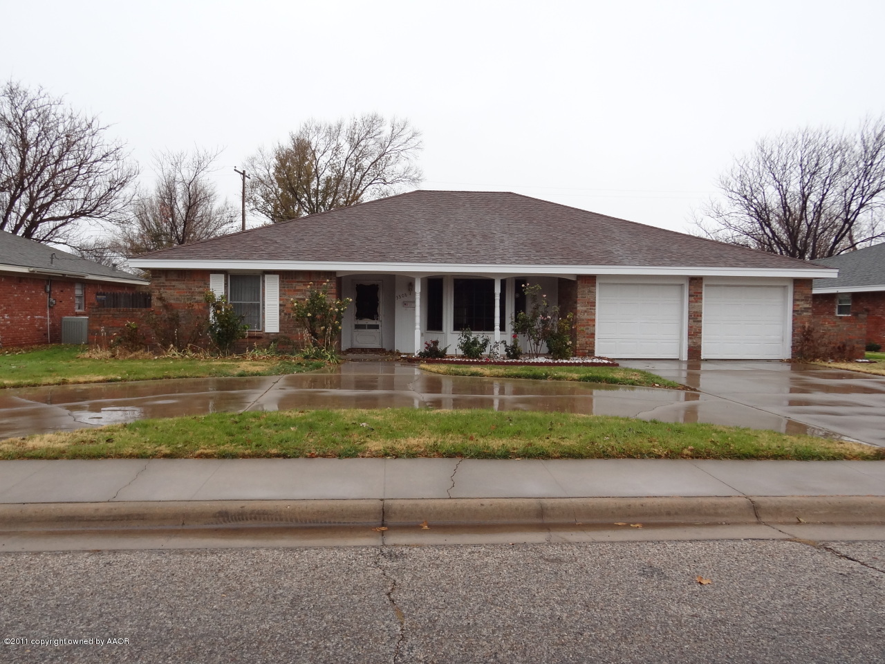 3308 Lombard Road Amarillo, TX 79106 - Photo 1 of 13 a front view of a house with a yard