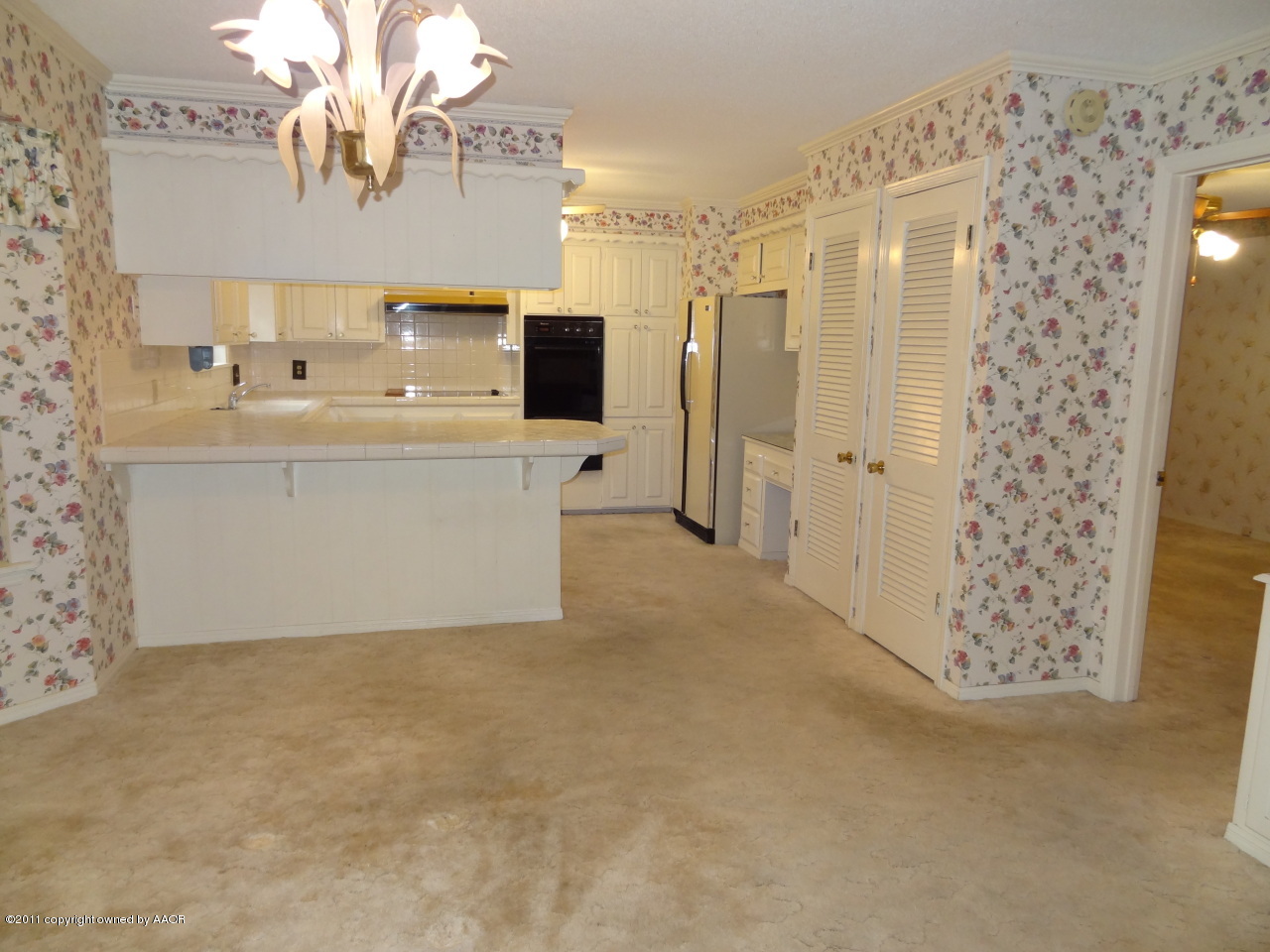 3308 Lombard Road Amarillo, TX 79106 - Photo 11 of 13 a bathroom with a sink a mirror and a shower