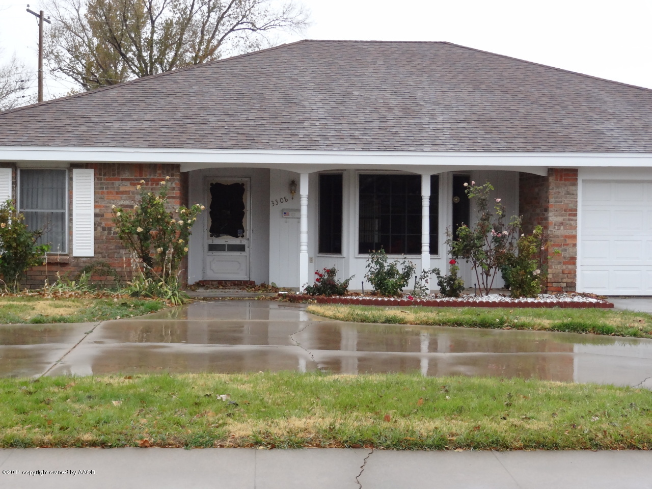 3308 Lombard Road Amarillo, TX 79106 - Photo 2 of 13 a front view of a house with garden