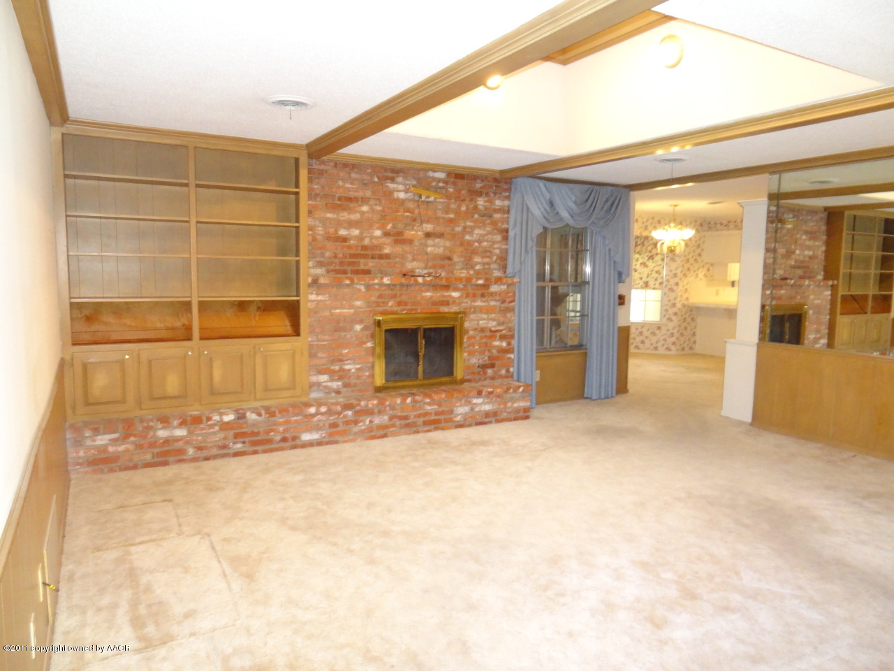 3308 Lombard Road Amarillo, TX 79106 - Photo 5 of 13 a view of an empty room with a fireplace