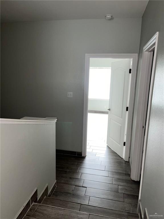 211 Baltic Avenue, Unit D Edinburg, TX 78539 - Photo 23 of 23 Hall featuring baseboards and wood finish floors
