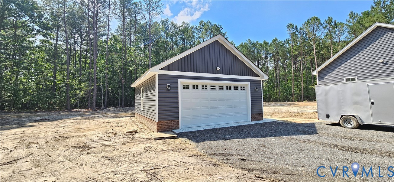 2982 Ashdale Road Center Cross, VA 22437 - Photo 5 of 17 Detached garage featuring dark gray siding, a whit