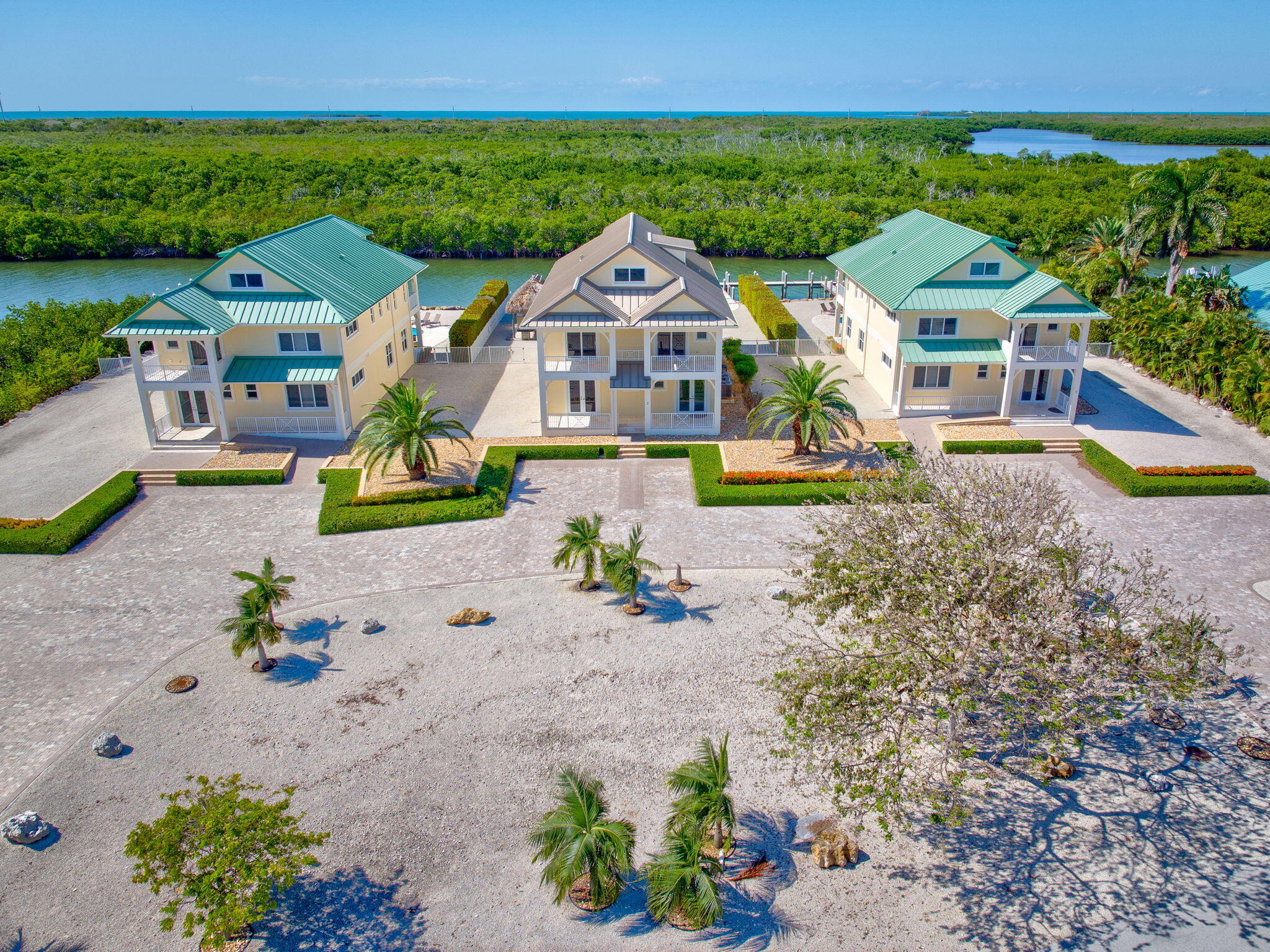 2394 Coco Plum Drive Marathon, FL 33050 - Photo 2 of 56 an aerial view of a house with a garden and lake view