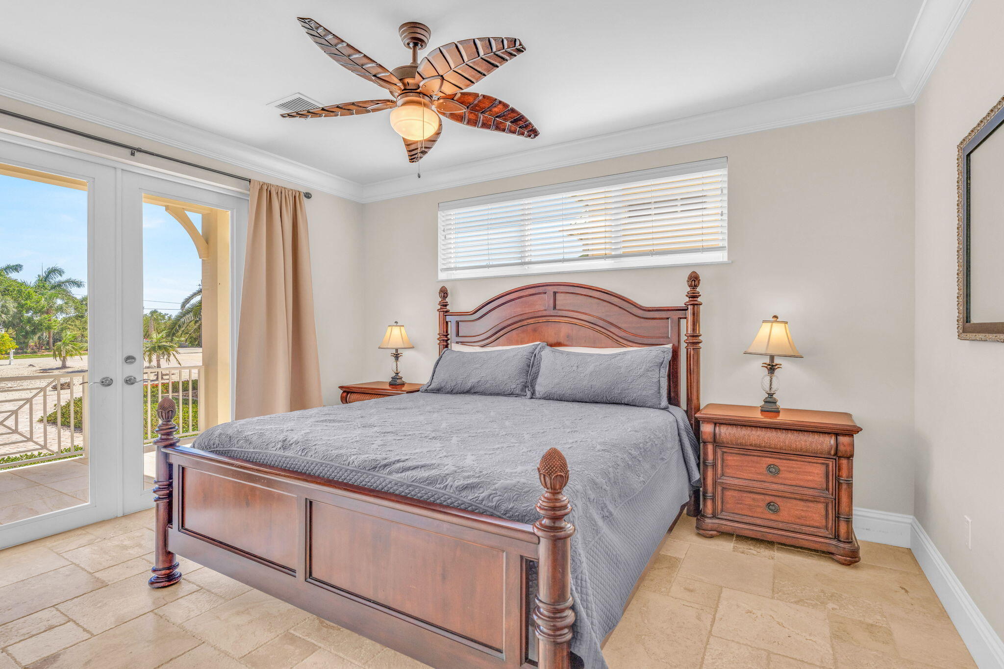 2394 Coco Plum Drive Marathon, FL 33050 - Photo 21 of 56 a bedroom with a bed and a chandelier