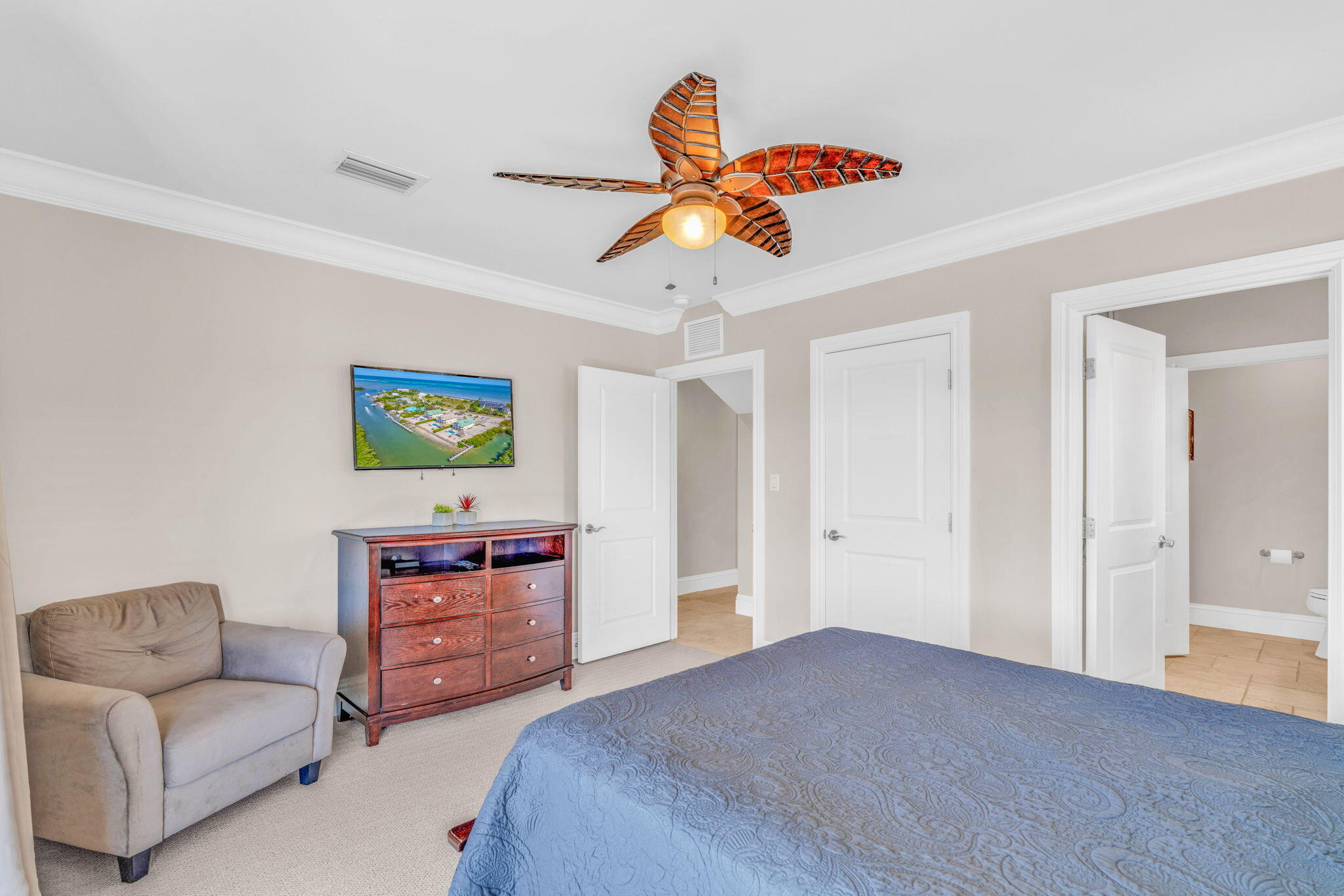2394 Coco Plum Drive Marathon, FL 33050 - Photo 30 of 56 a bedroom with a bed and a couch