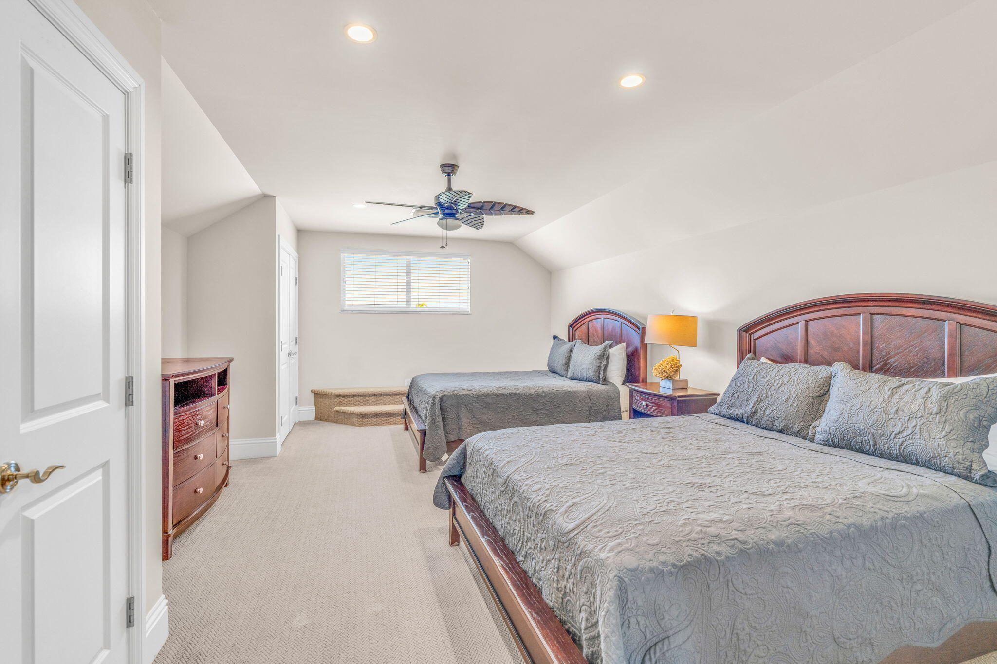 2394 Coco Plum Drive Marathon, FL 33050 - Photo 41 of 56 a bedroom with a bed and a chandelier